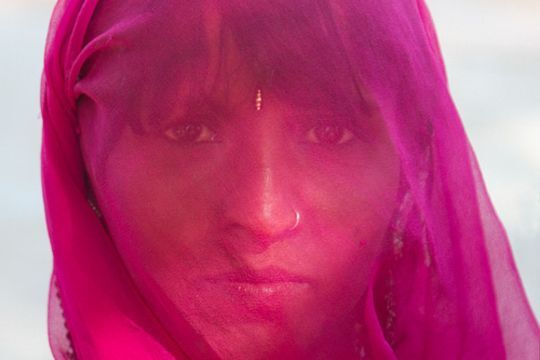 indian women with pink scarf